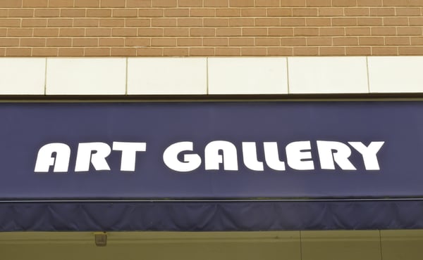 Generic sign on awning of brick-and-mortar art gallery (this is not the name of the gallery)